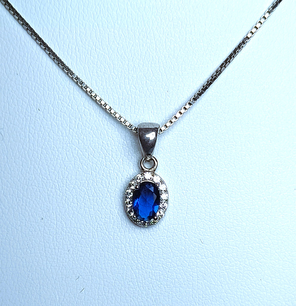 COLLANA IN ARGENTO 925 E PENDENTE CON ZIRCONE CENTRALE BLU E BIANCHI A CONTORNO